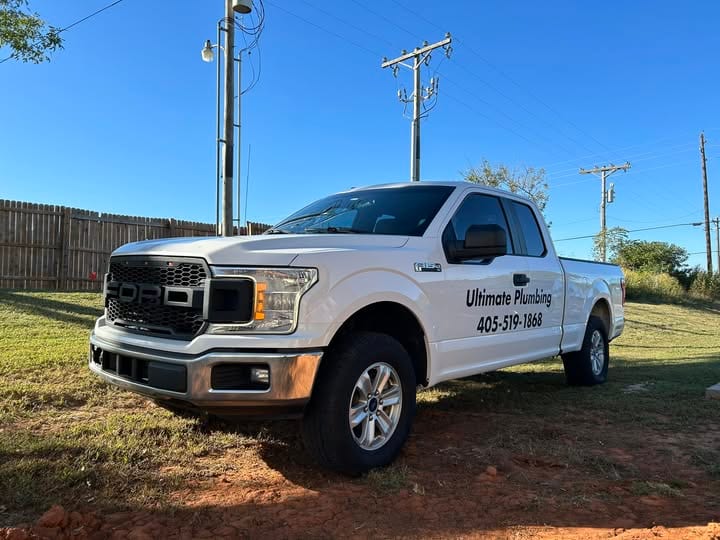 Ultimate Plumbing branded Ford F-150 work truck parked on a job (duplicate of the copper-manifold truck shot)
